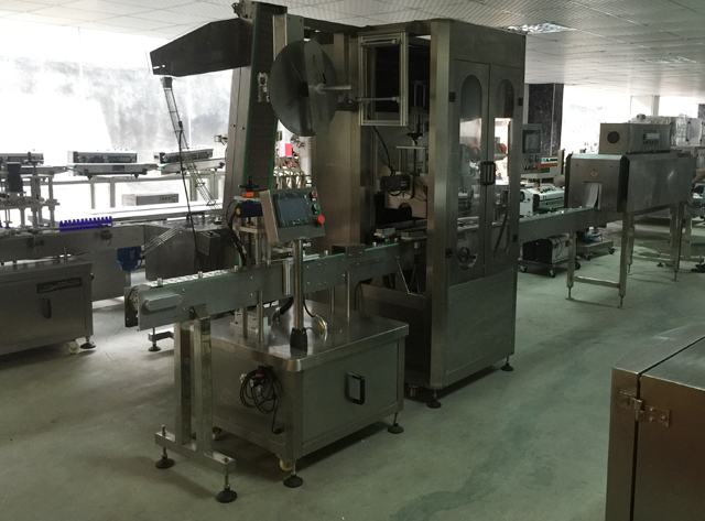 Etiquetadora de cinta adhesiva.jpg