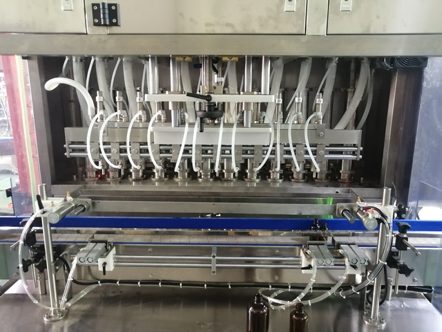 Máquina llenadora de 12 cabezales con calentador mezclador (4).jpg