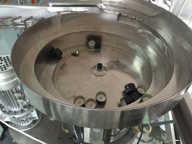 Sistema de alimentación por vibración de tapones.jpg